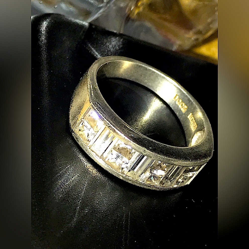 Sterling Silver Solid 5.6 grams, total of 8 princess cut diamonds 1/8 carat each